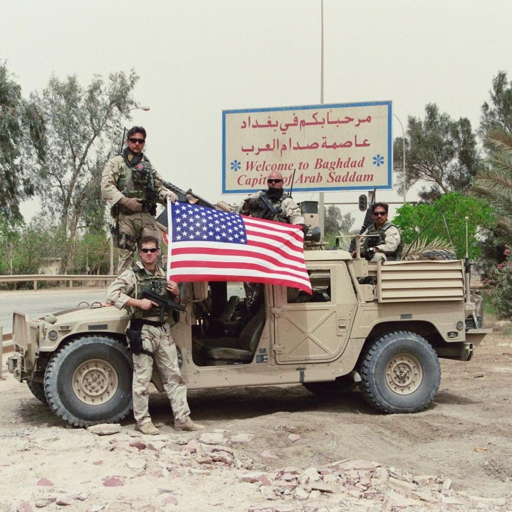 Stephen Stough with his unit on a Humvee entering Baghdad, 2003
